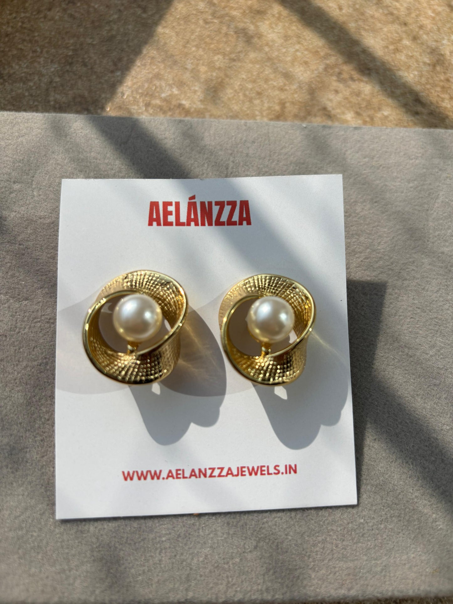 Aelanzza Dainty Pearl Earrings lifestyle shot – gold pearl studs packaging India